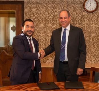 AUC Provost Ehab Abdel-Rahman and Dow Egypt's Country Manager Momen Adel sign the AUC-Dow research and development partnership