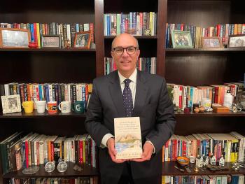 Sherif Kamel holds his debut book