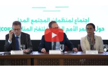 Three people sitting in a panel