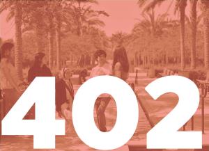 group of boys and girls standing with palm trees in the background. 402 written on the picture in white