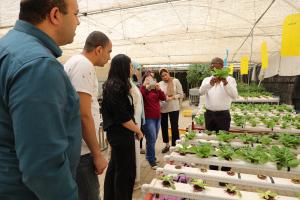 water excellence students in tour of green house in AUC Campus