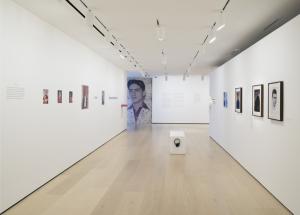 Inside of the Hammer Museum, displaying photographs taken by Van Leo on white walls