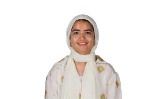 Headshot of a veiled girl smiling