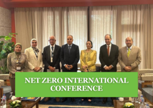 People standing together in a closed room, text reads "Net Zero International Conference"