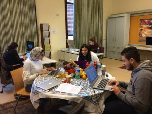 a group of students sitting around a table