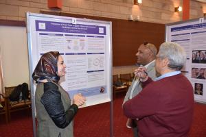 student presenting the poster to judges
