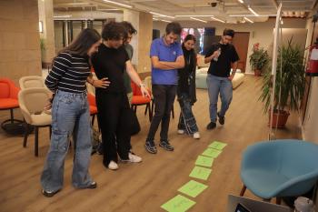 a group of students working together at a design thinking workshop