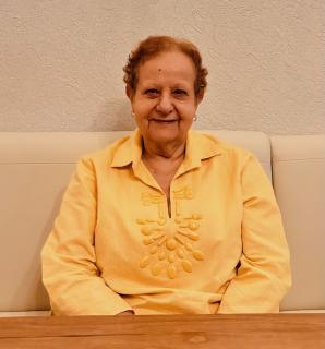 A female sitting on a couch