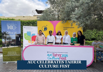 Males and females are standing behind a counter and smiling. Text: AUC Celebrates Tahrir Culture Fest