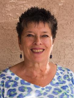 A woman (Sandra McNabb) smiling 