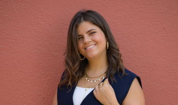 fatima hussein posing with coral background