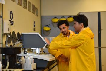 Yusef Primus and Anthony Nguyen work in a manufacturing laboratory