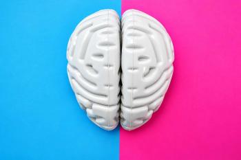 A brain is split in half between a blue and pink background (representing male and female)