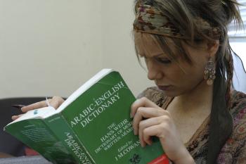 AUC student reading a book