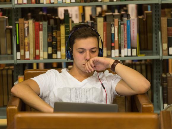 student in library