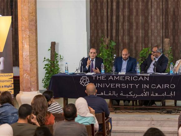 Four men sitting on a panel, The American University in Cairo, الجامعة الأمريكية بالقاهرة
