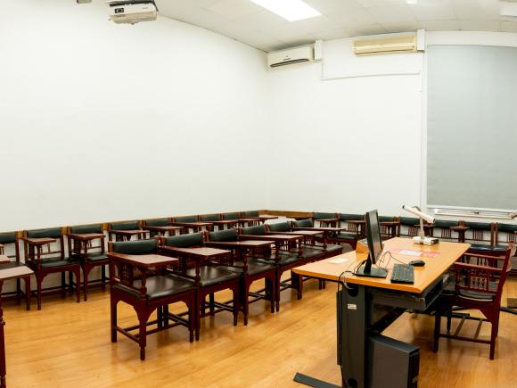 Chairs, tables, a computer and a board
