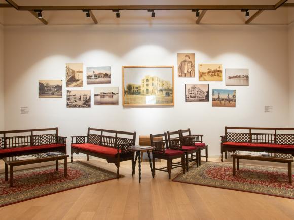 Seating area and paintings in a room