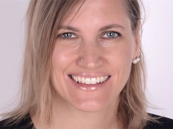 A woman smiling