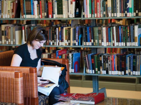 A girl reading in the library