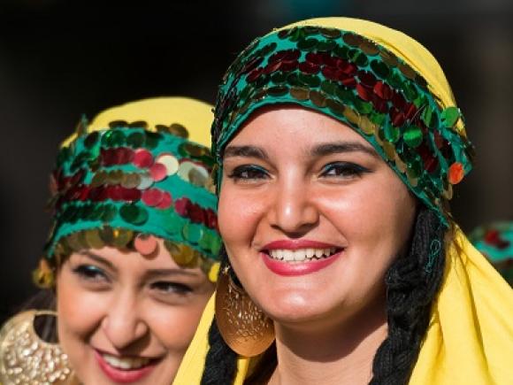Smiling girls with folklore costumes