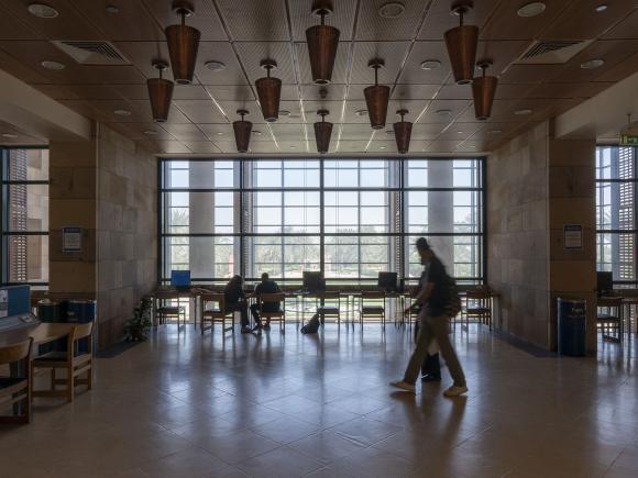 Students studying inside the library big hall