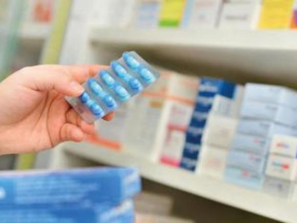 hand holding medical tablets