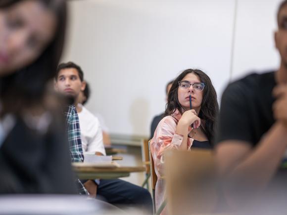 A gril in class thinking