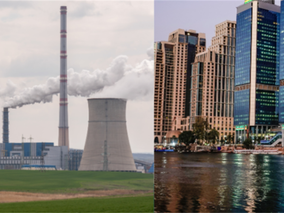 Smoking pipes with greenery, and tall buildings in front of a river