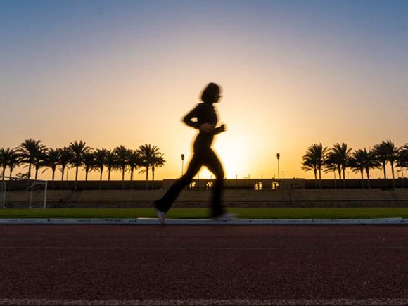 a girl running in the track