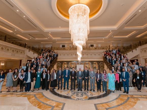 Large group of people standing in a group picture on stairs