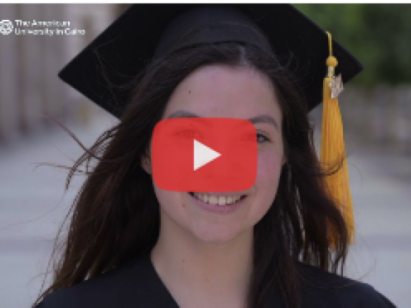 a girl wearing a black gap and gown