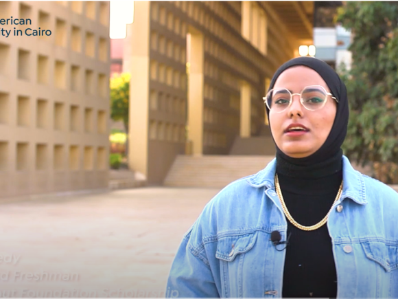 A girl in front of library