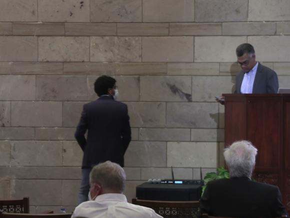 conference room with a man standing on podium