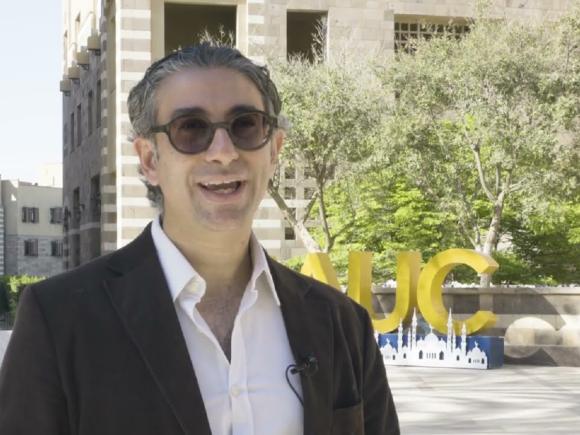 Man wearing a suit and sunglasses