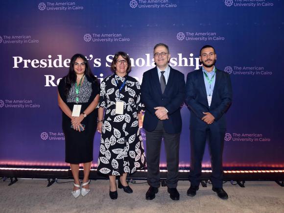 auc president with scholarship students