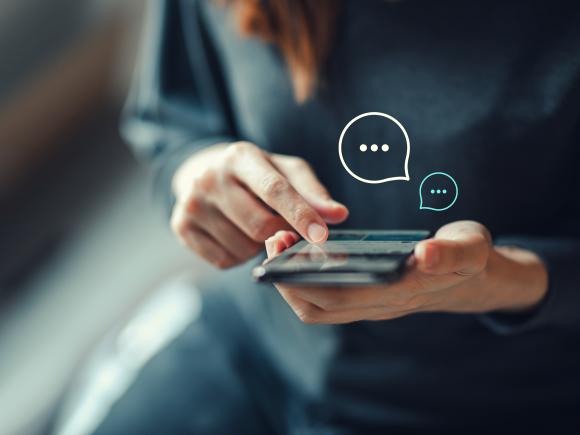 Woman holding a mobile in her hand