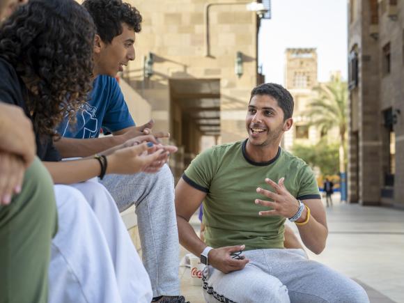 Students on campus having a conversation