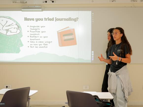 Student up presenting in a psychology class