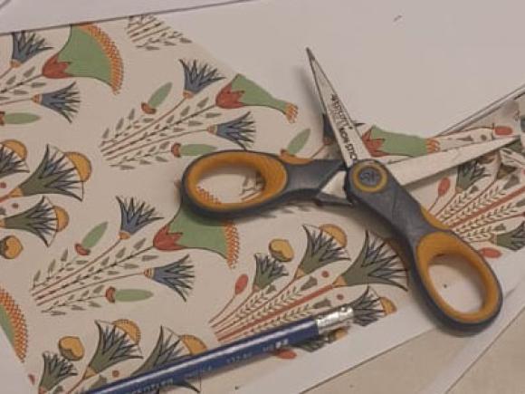 Picture of ancient Egyptian lotus flowers and scissors 