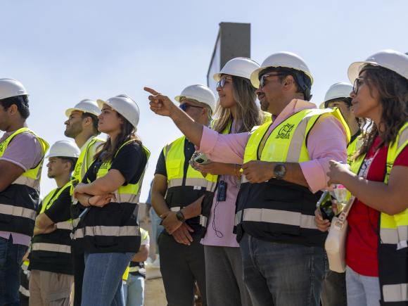 construction engineering students on location wearing safety gear 