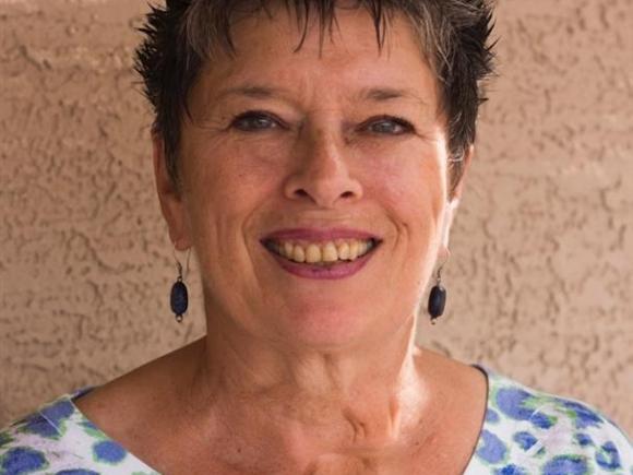 A woman (Sandra McNabb) smiling