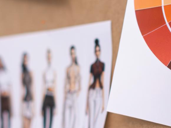 two white papers with drawings on them