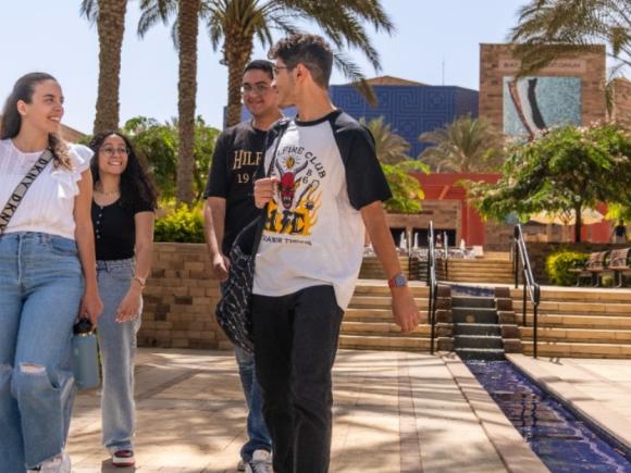 Students walking near the water at the CVC