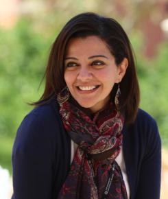 Lady wearing a scarf smiling