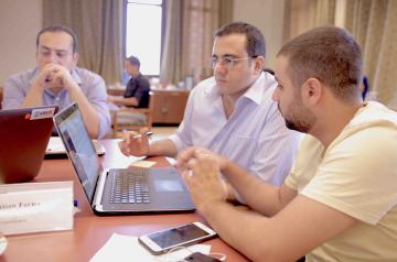 student working with professor on computer