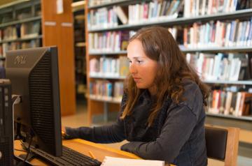 student in library