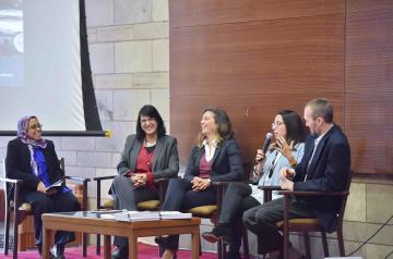 Faculty members sitting around table