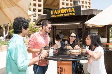 Students having coffe in L'Aroma on campus