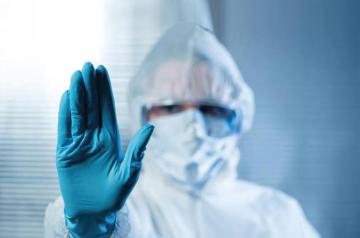 person wearing hazmat suit